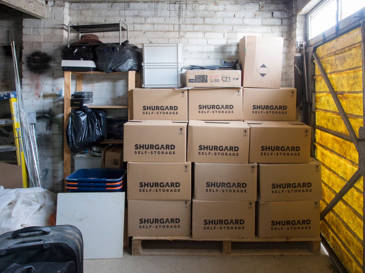 Services-02 A stack of storage boxes in a well-organized warehouse interior.